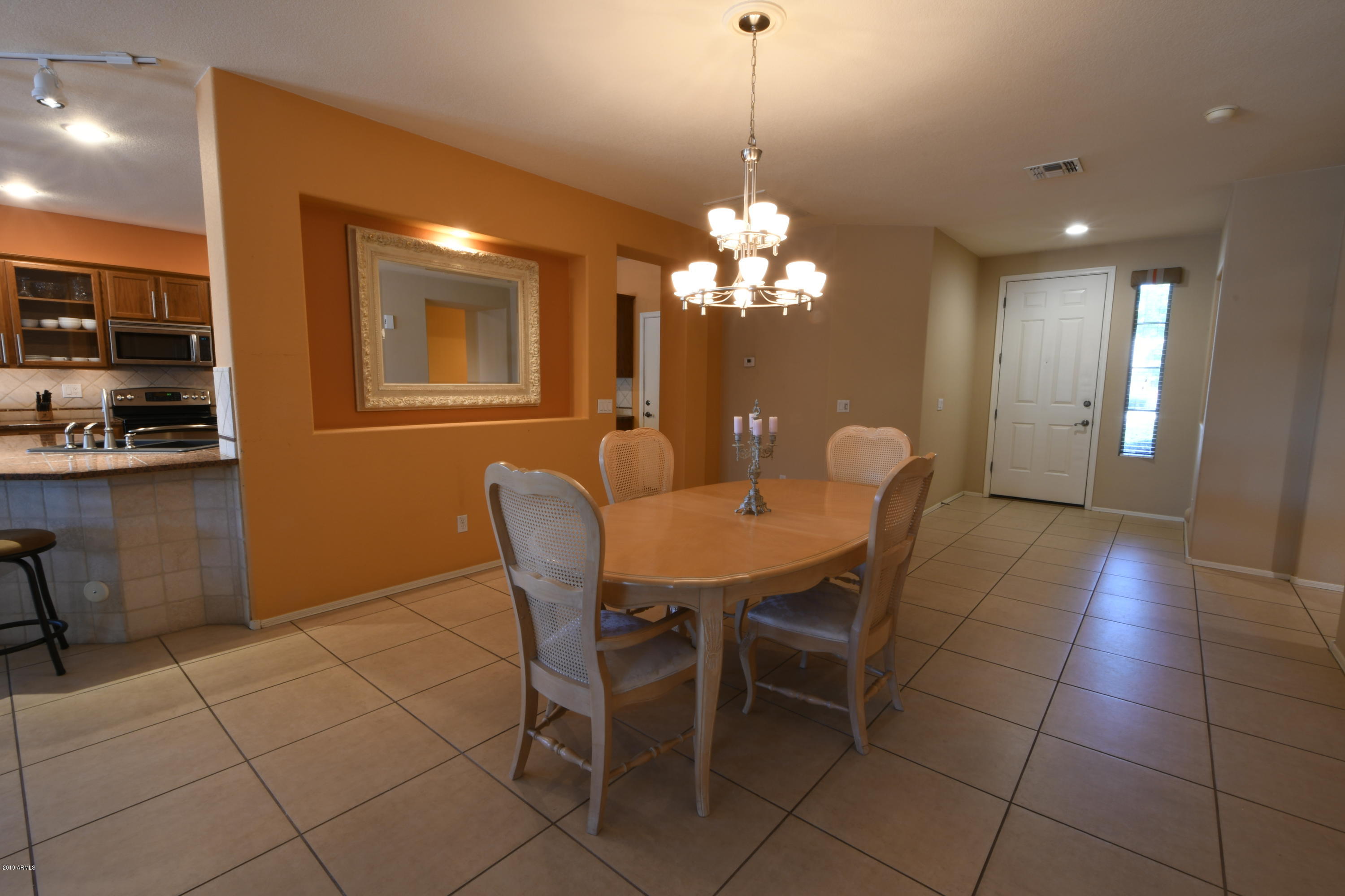 2226 West Carson Road Phoenix, AZ 85041 - Photo 11 of 29 a view of a dining room with furniture