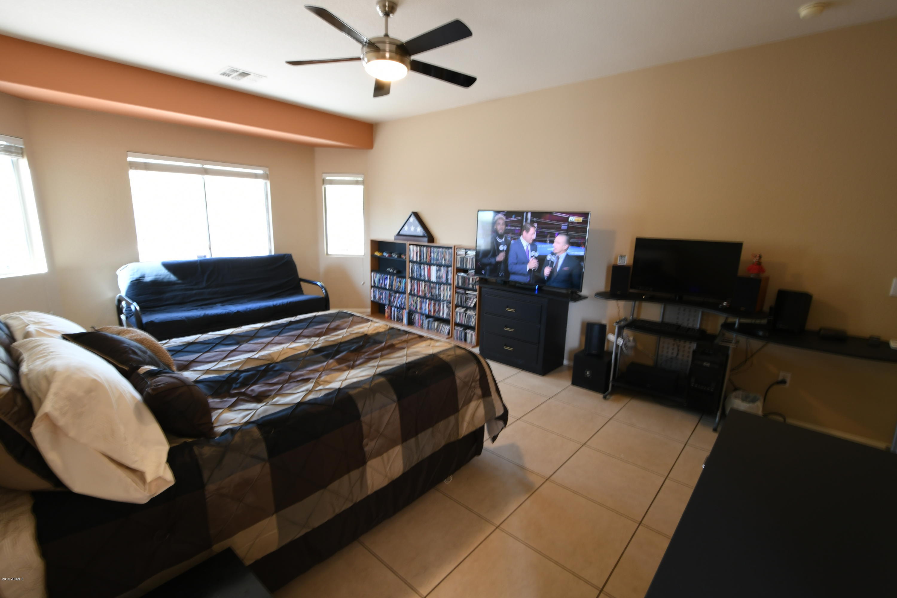 2226 West Carson Road Phoenix, AZ 85041 - Photo 13 of 29 a bedroom with a bed dresser and a window