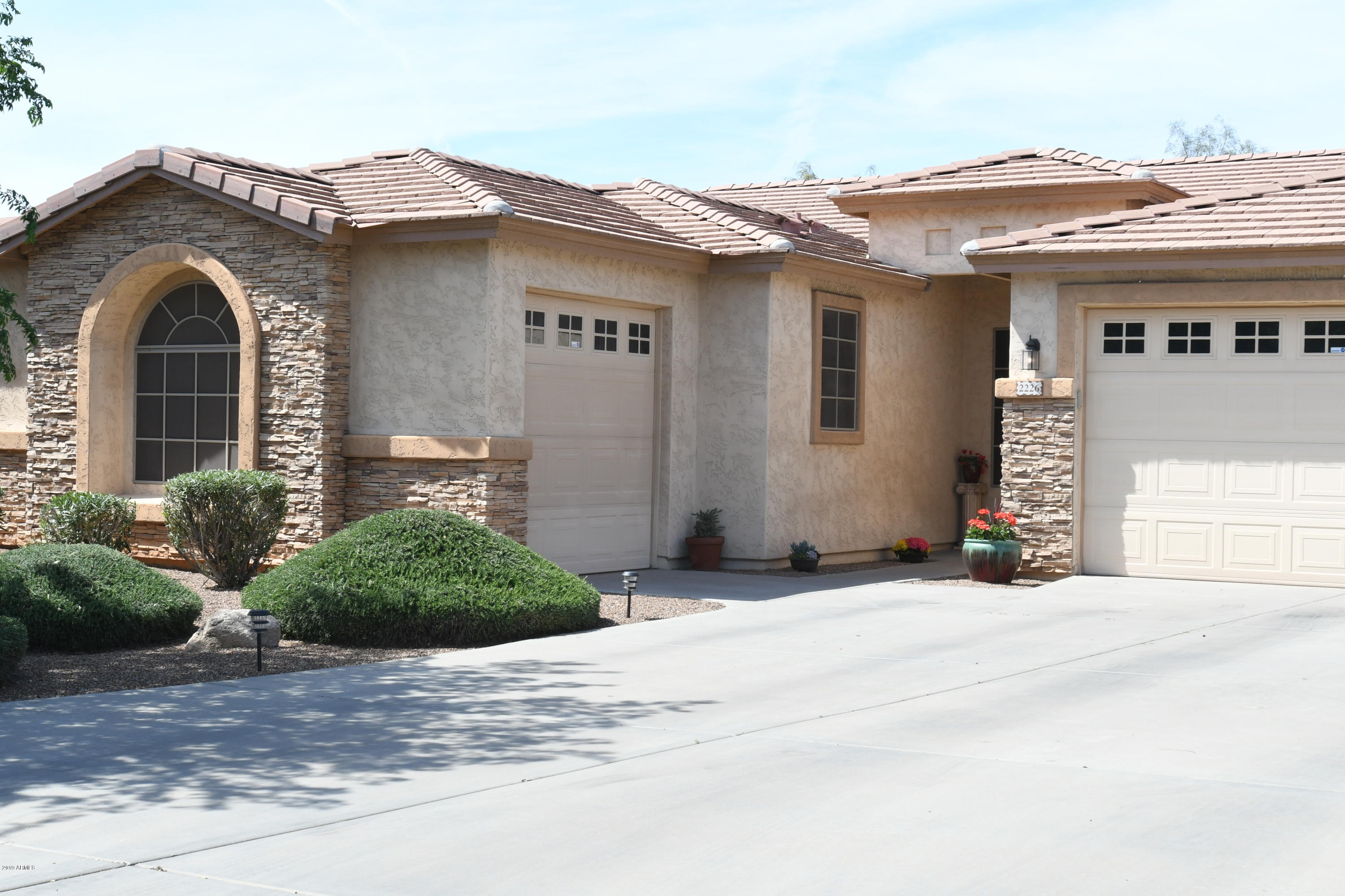 2226 West Carson Road Phoenix, AZ 85041 - Photo 2 of 29 a front view of a house with a yard