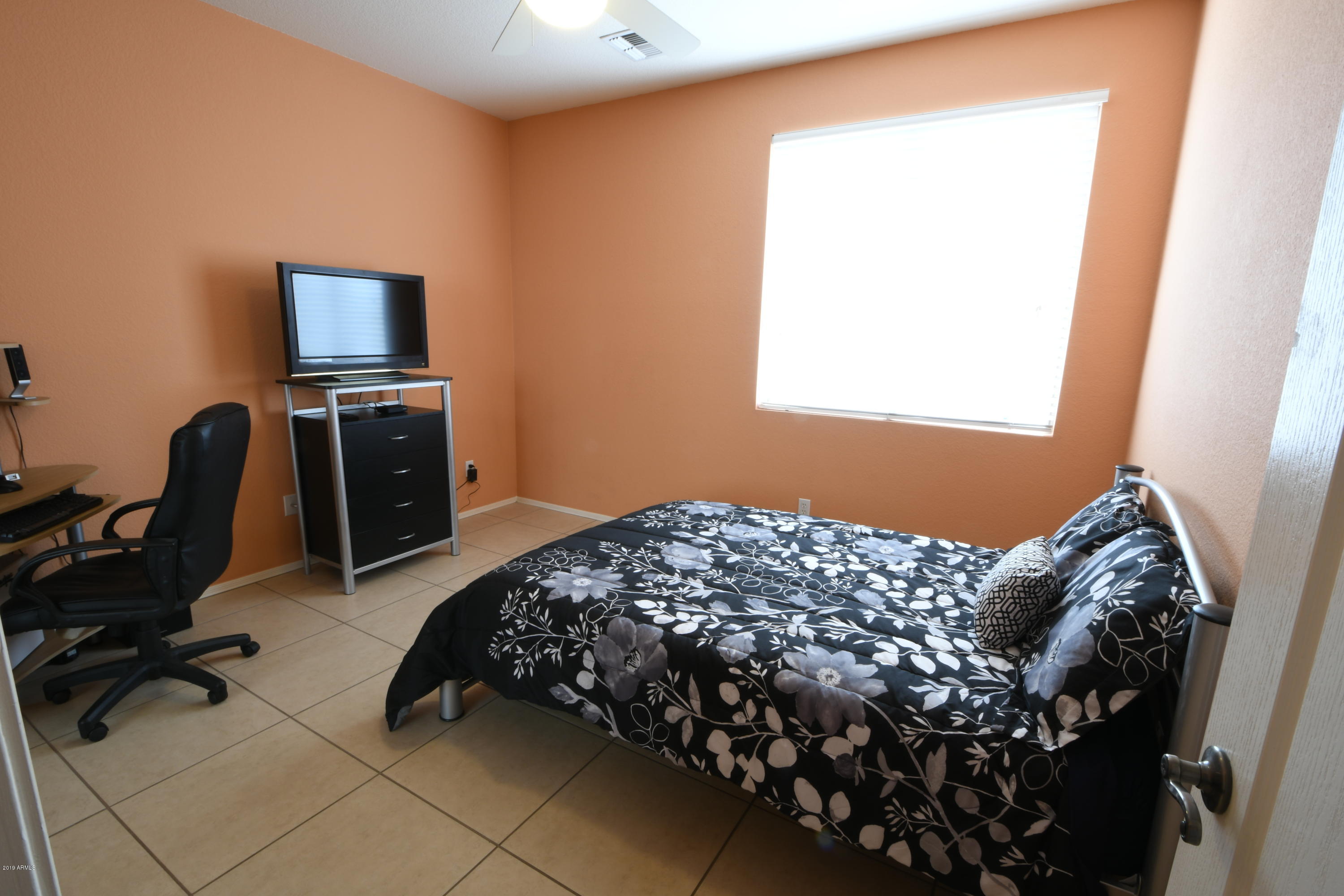 2226 West Carson Road Phoenix, AZ 85041 - Photo 21 of 29 a bedroom with bed and a window