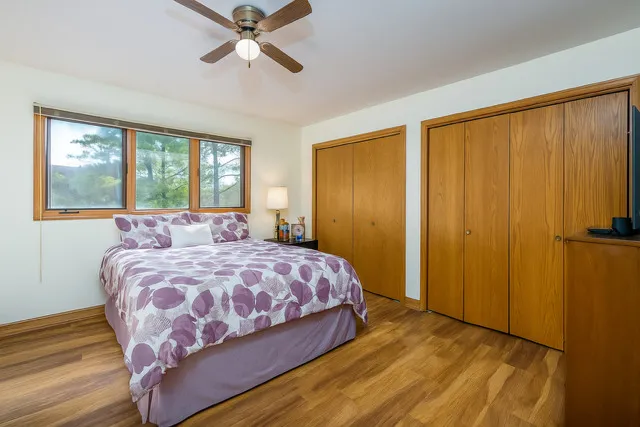 a bedroom with a bed and window