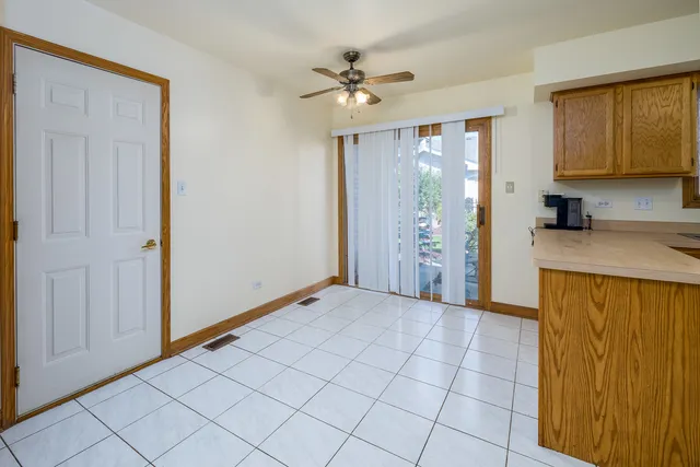 a view of a kitchen with a sink and cabinets