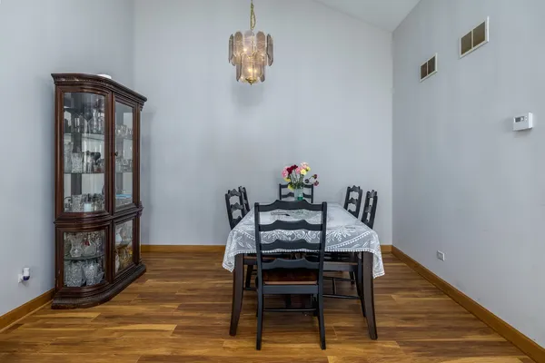a view of a dining room with furniture and wooden floor