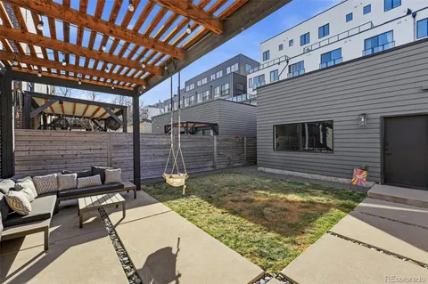 a view of a backyard with sitting area
