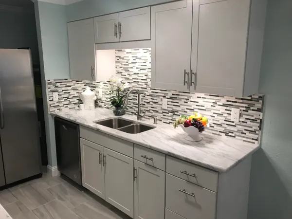 a kitchen with sink cabinets and window