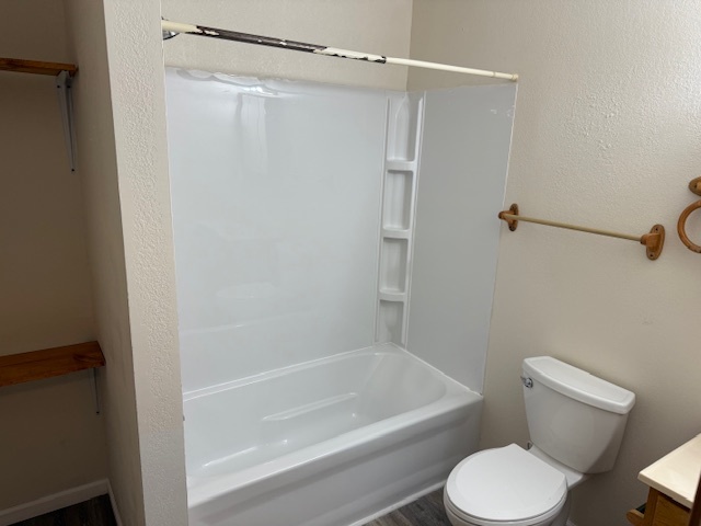 312 East Hester Street Carbondale, IL 62901 - Photo 14 of 14 a white toilet and tub sitting next to a bathroom sink