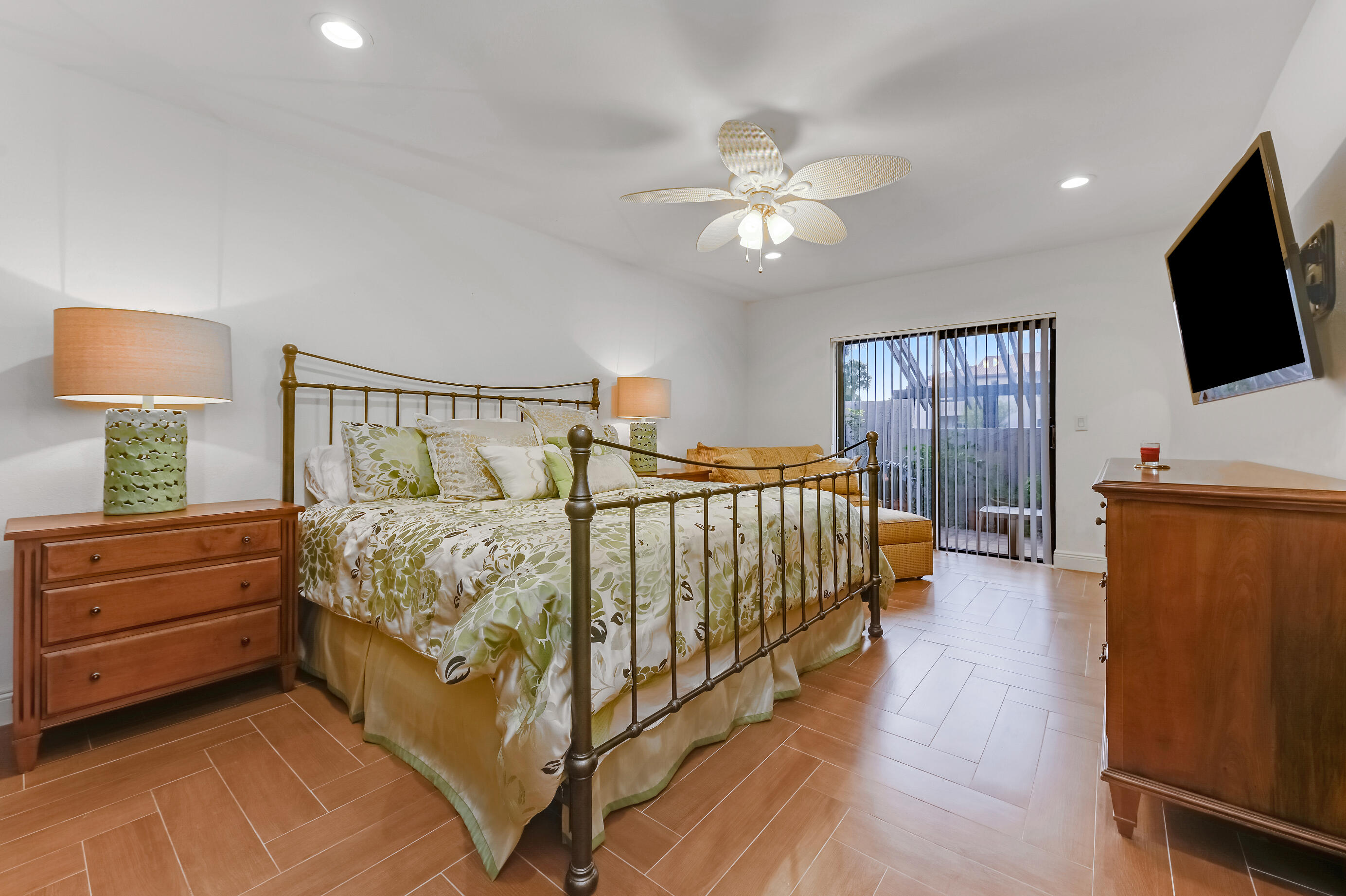 9300 Vista Del Lago, Unit 6B Boca Raton, FL 33428 - Photo 14 of 22 a bedroom with a bed and a flat screen tv