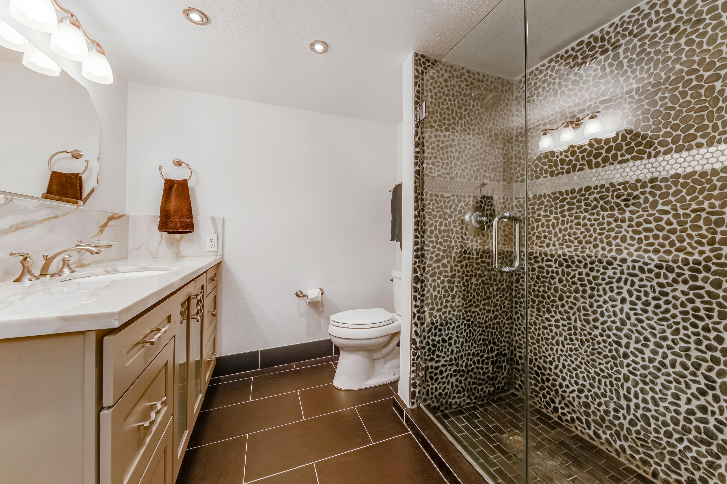 9300 Vista Del Lago, Unit 6B Boca Raton, FL 33428 - Photo 15 of 22 a bathroom with a sink toilet and shower