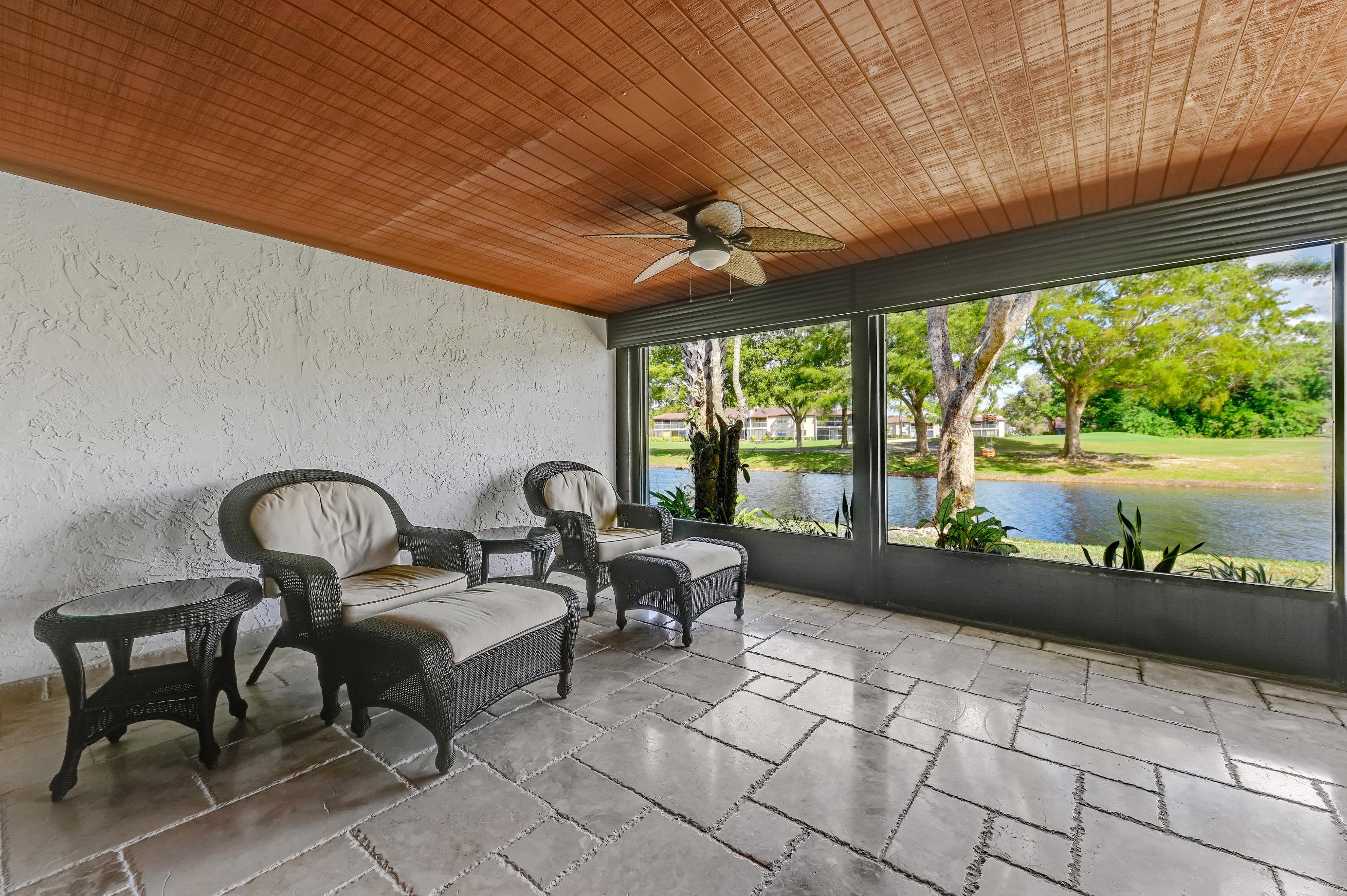 9300 Vista Del Lago, Unit 6B Boca Raton, FL 33428 - Photo 18 of 22 a living room with furniture and large windows