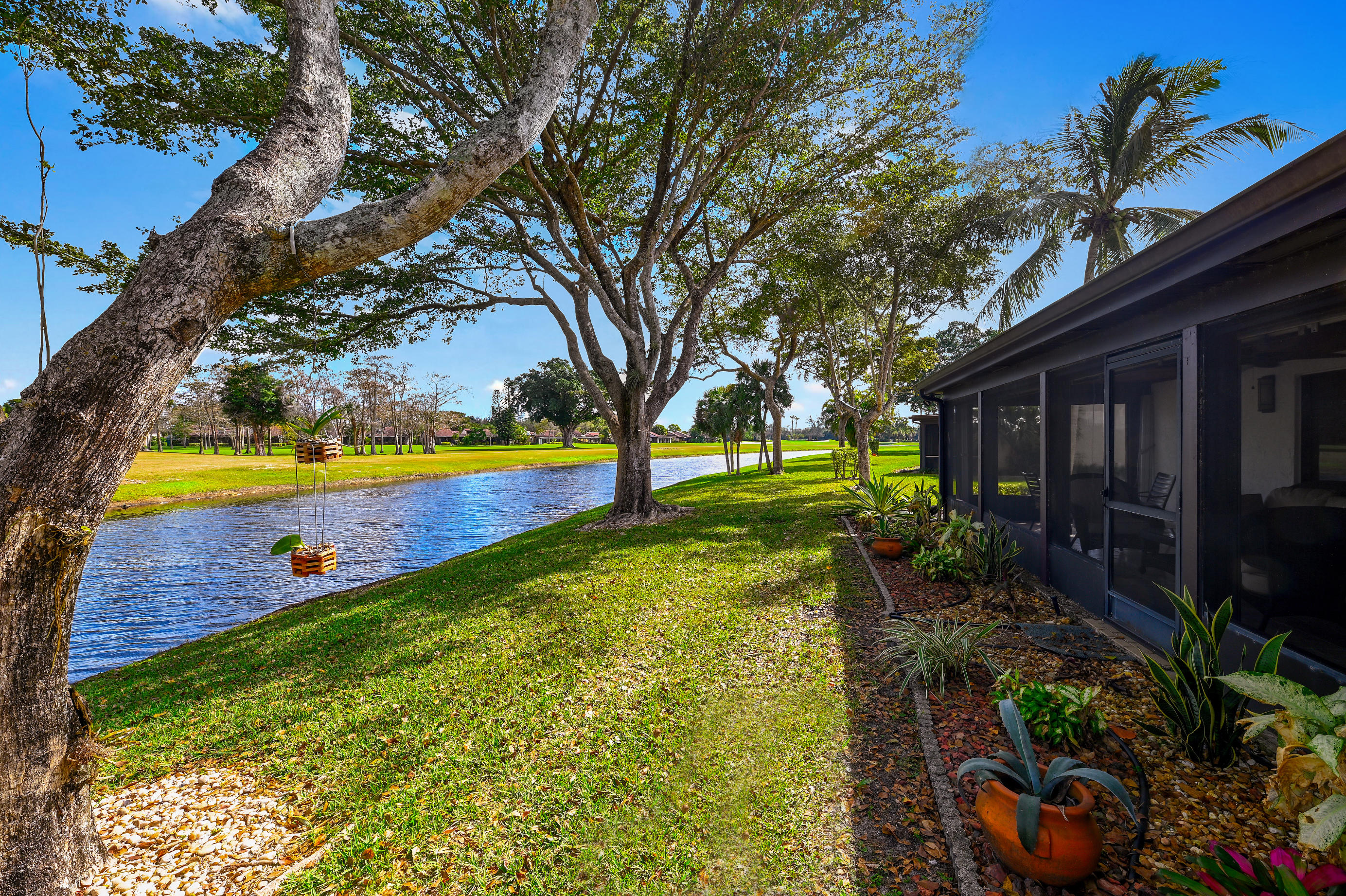 9300 Vista Del Lago, Unit 6B Boca Raton, FL 33428 - Photo 20 of 22 a view of swimming pool with a backyard