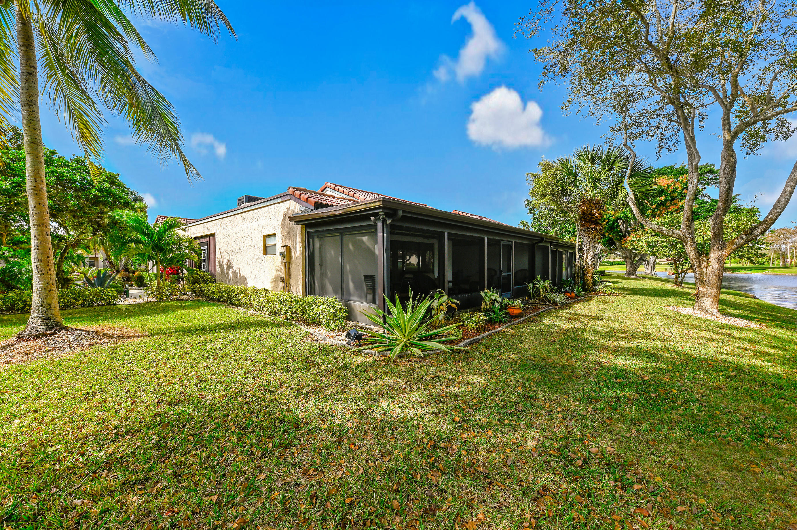 9300 Vista Del Lago, Unit 6B Boca Raton, FL 33428 - Photo 21 of 22 a view of a house with a yard