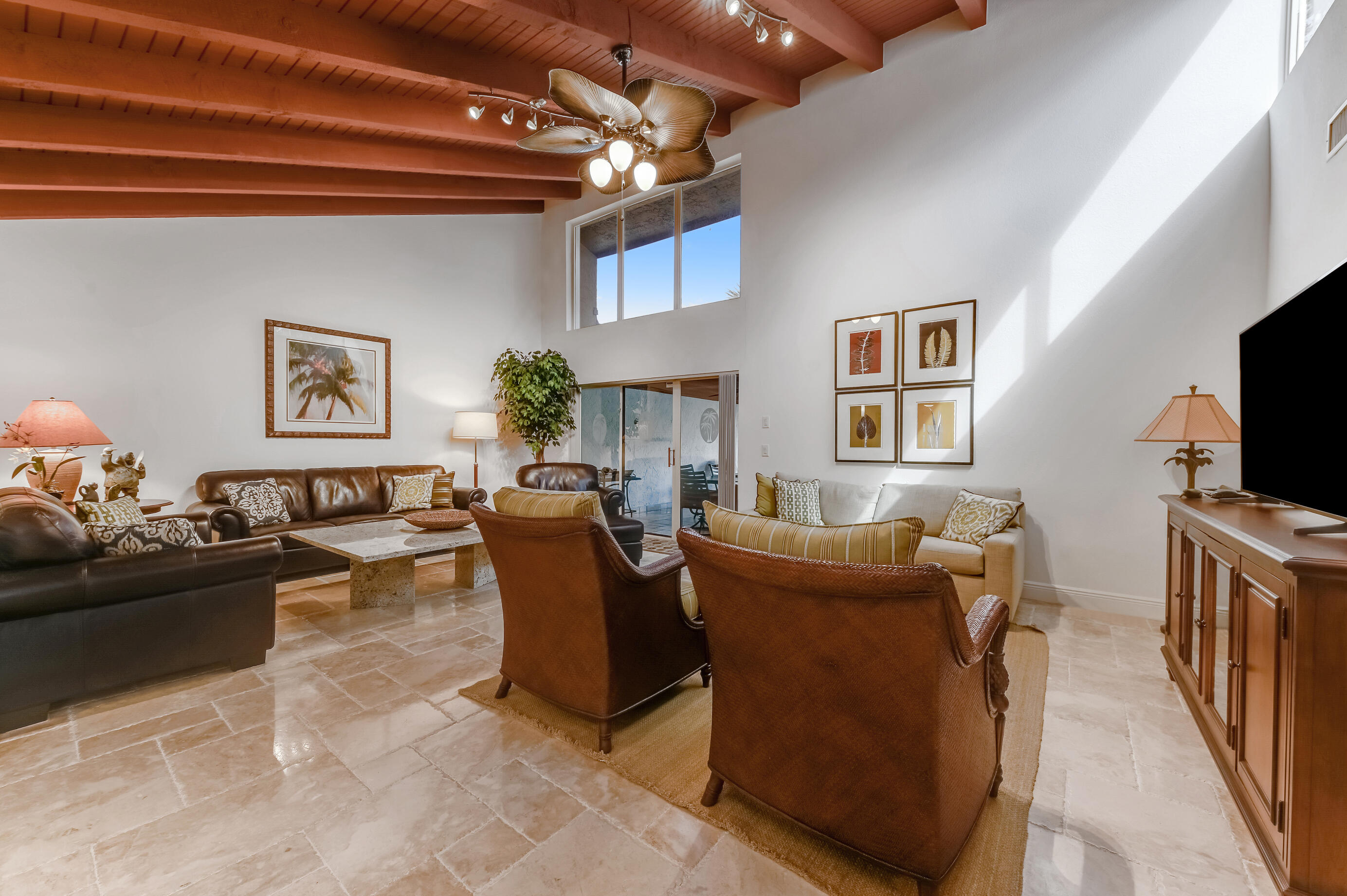 9300 Vista Del Lago, Unit 6B Boca Raton, FL 33428 - Photo 4 of 22 a living room with fireplace furniture and a flat screen tv