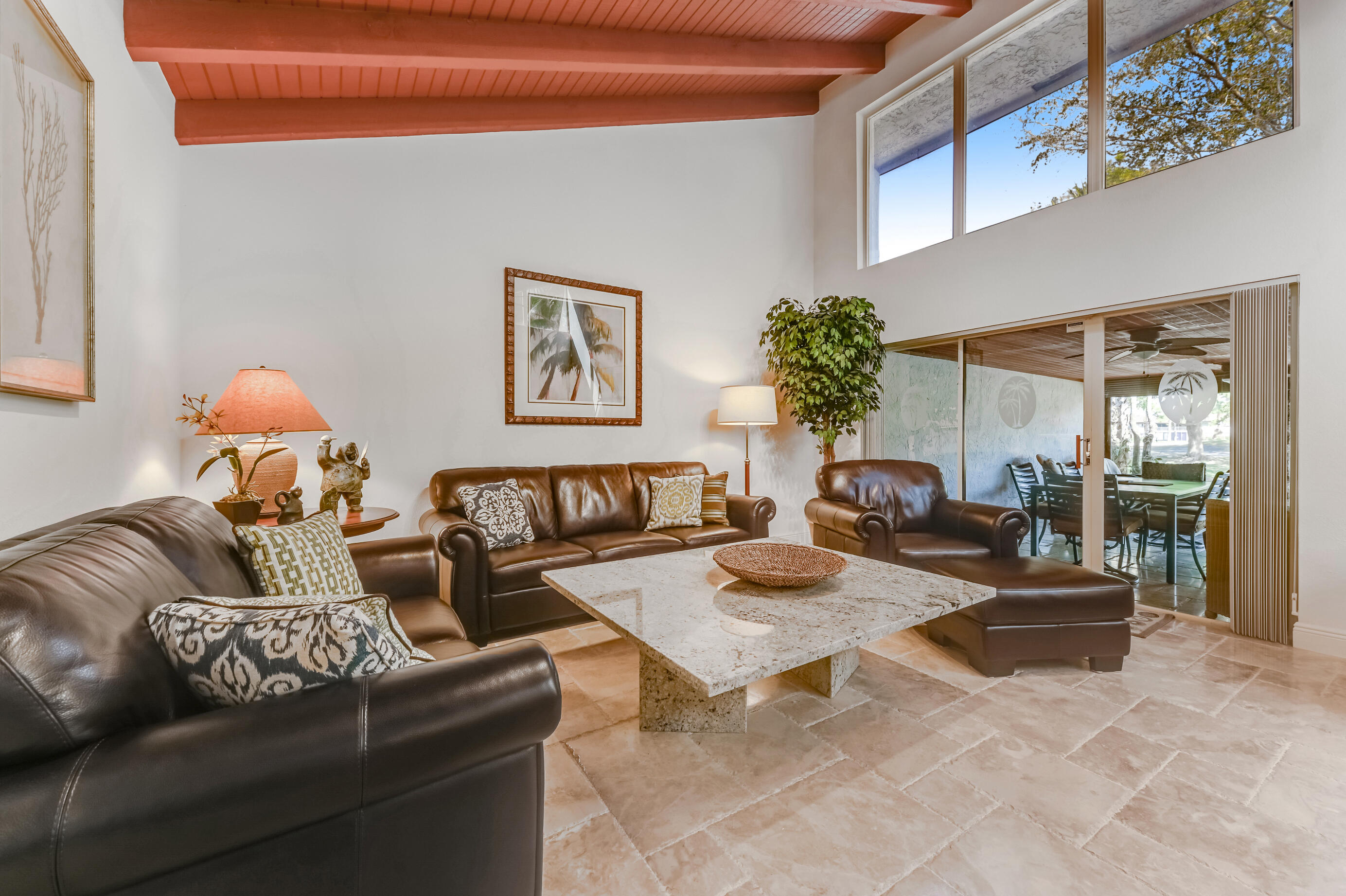 9300 Vista Del Lago, Unit 6B Boca Raton, FL 33428 - Photo 5 of 22 a living room with furniture and a potted plant