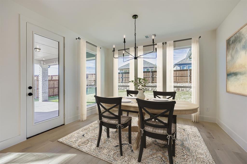 1841 Pk Vista Way Midlothian, TX 76065 - Photo 5 of 28 a view of a dining room with furniture window and wooden floor