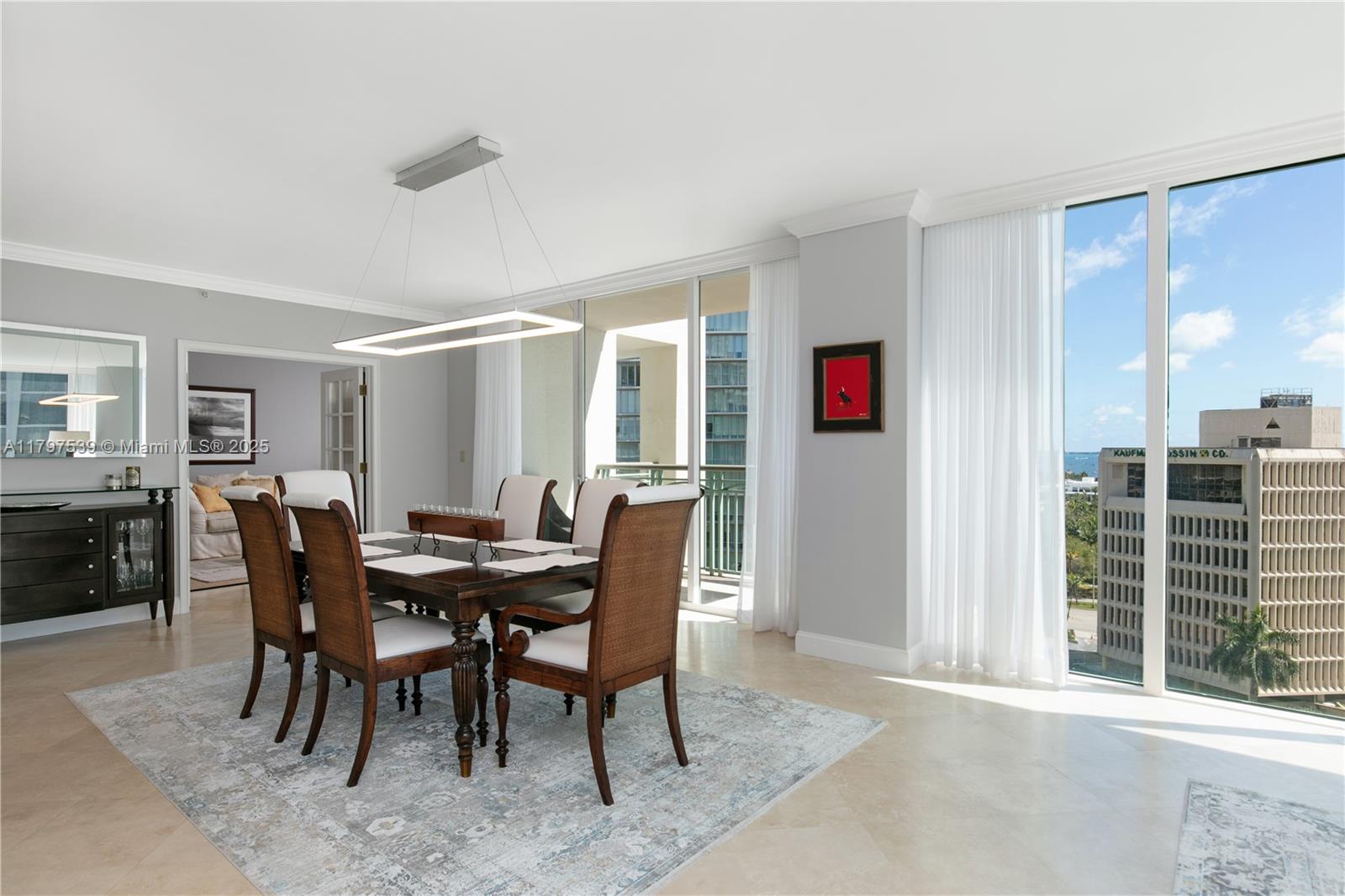 3350 Southwest 27th Avenue, Unit 902 Miami, FL 33133 - Photo 2 of 40 a view of a dining room with furniture