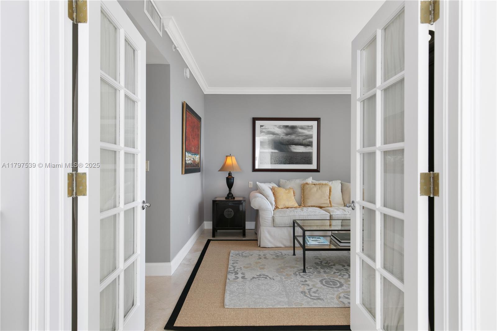 3350 Southwest 27th Avenue, Unit 902 Miami, FL 33133 - Photo 22 of 40 a living room with furniture and a rug