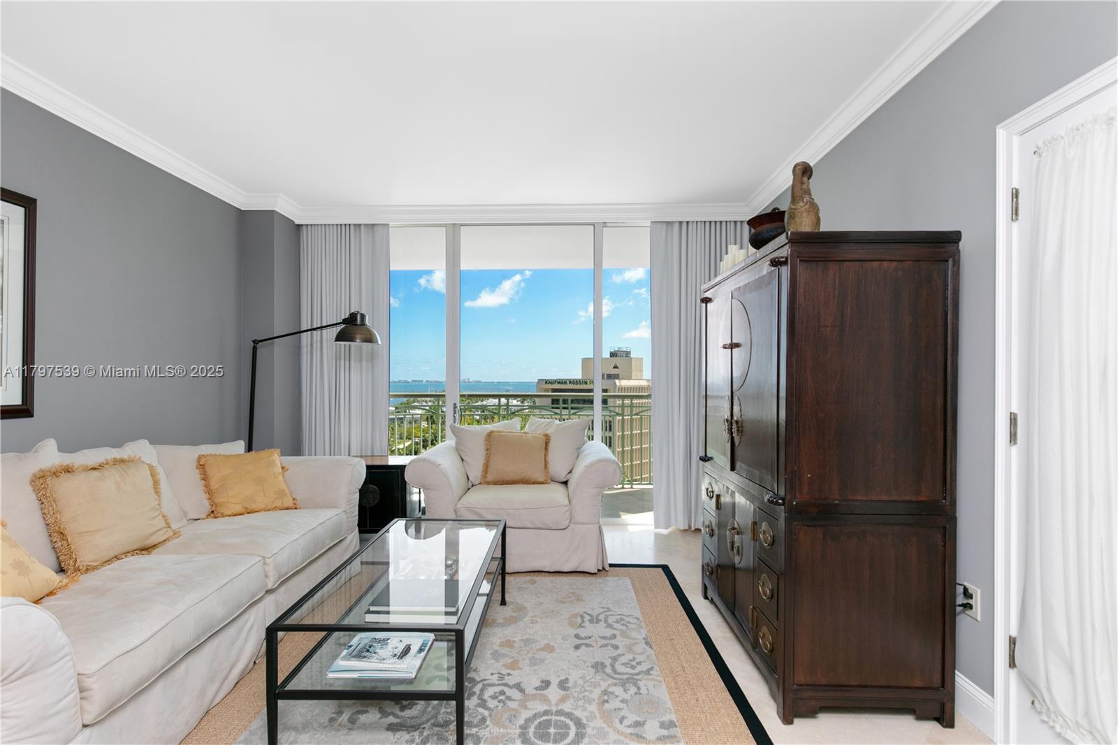 3350 Southwest 27th Avenue, Unit 902 Miami, FL 33133 - Photo 24 of 40 a living room with furniture and a large window