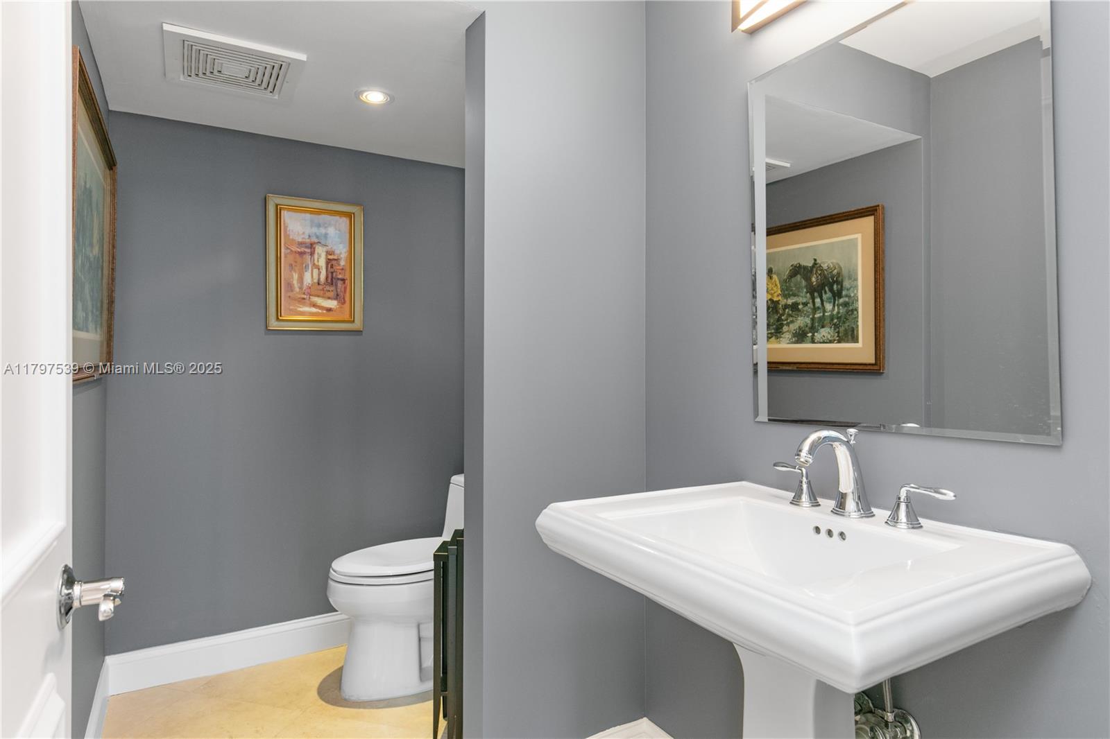 3350 Southwest 27th Avenue, Unit 902 Miami, FL 33133 - Photo 27 of 40 a bathroom with a sink and a toilet