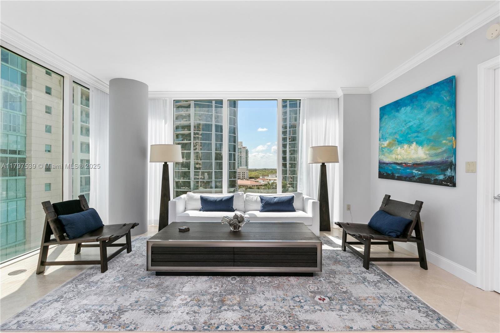 3350 Southwest 27th Avenue, Unit 902 Miami, FL 33133 - Photo 3 of 40 a living room with furniture and a large window