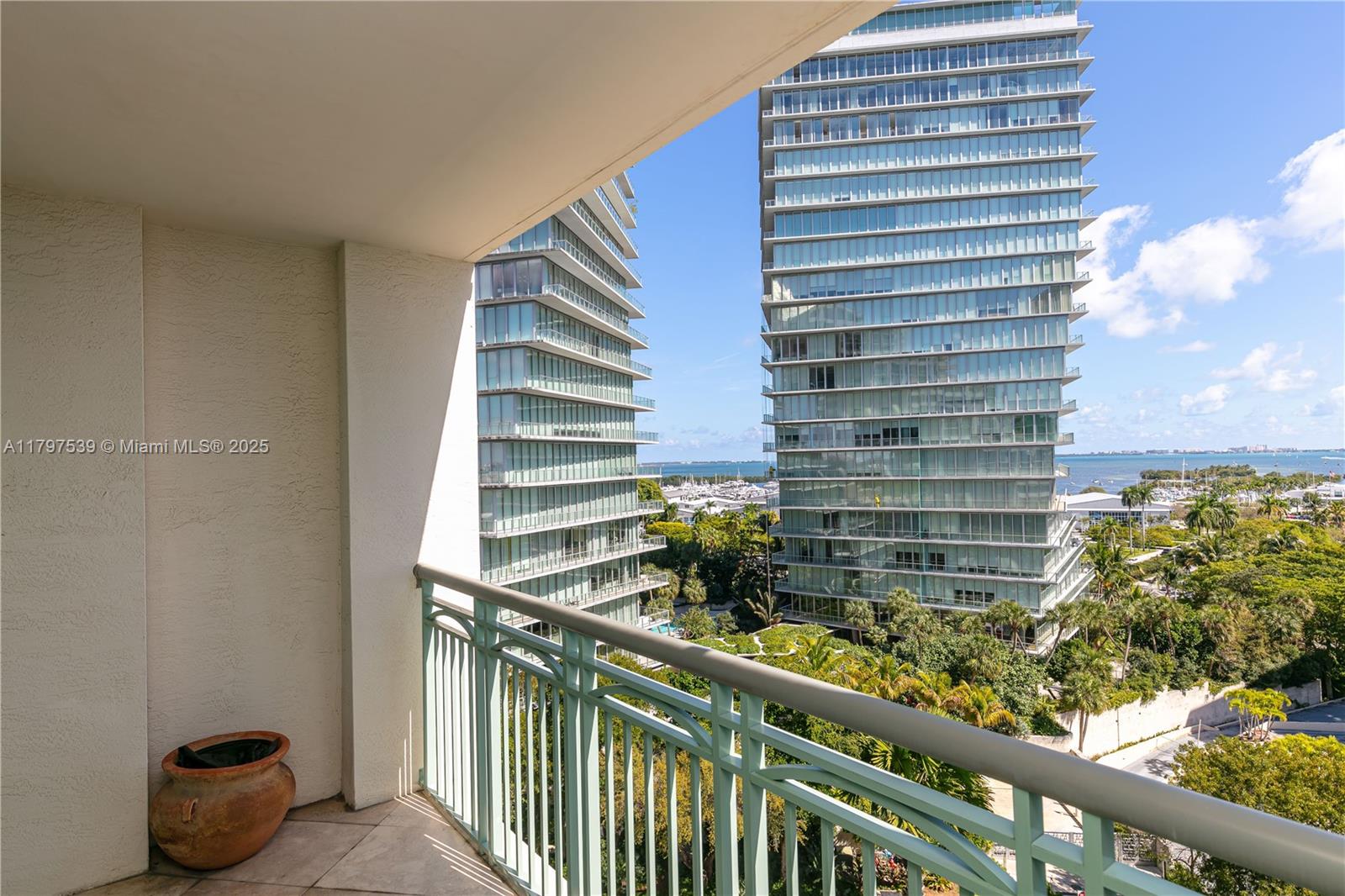 3350 Southwest 27th Avenue, Unit 902 Miami, FL 33133 - Photo 37 of 40 a view of a balcony with outdoor seating