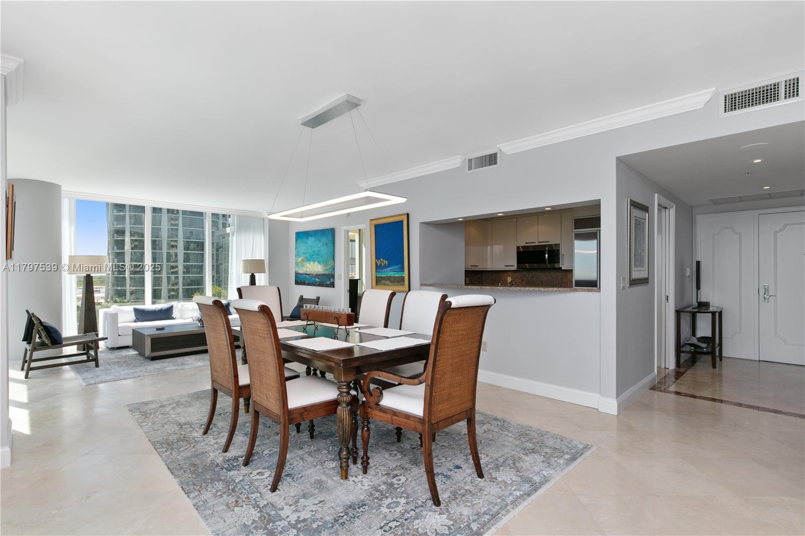3350 Southwest 27th Avenue, Unit 902 Miami, FL 33133 - Photo 4 of 40 a view of a dining room with furniture