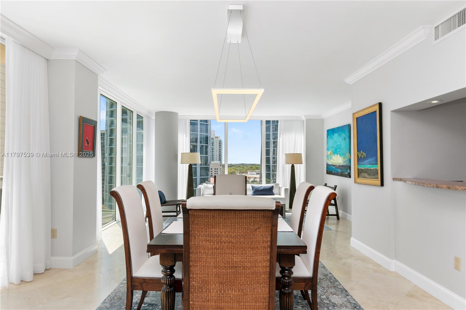 3350 Southwest 27th Avenue, Unit 902 Miami, FL 33133 - Photo 8 of 40 a view of a dining room with furniture window and outside view