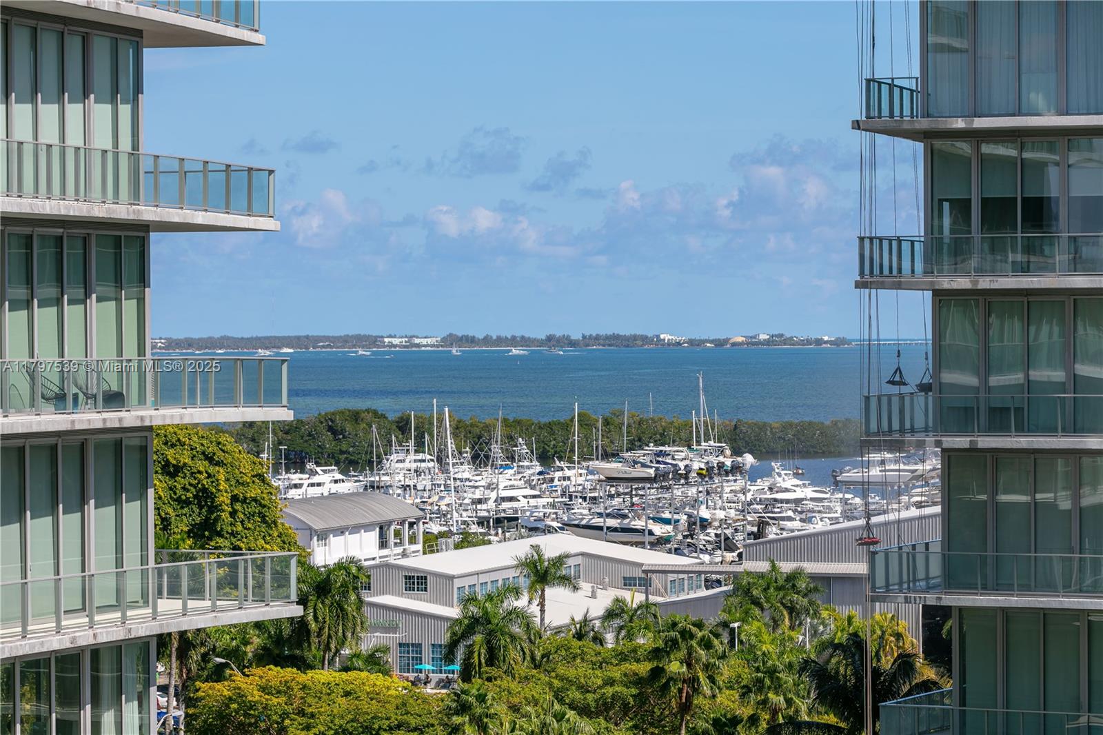 3350 Southwest 27th Avenue, Unit 902 Miami, FL 33133 - Photo 9 of 40 a view of a lake with tall buildings