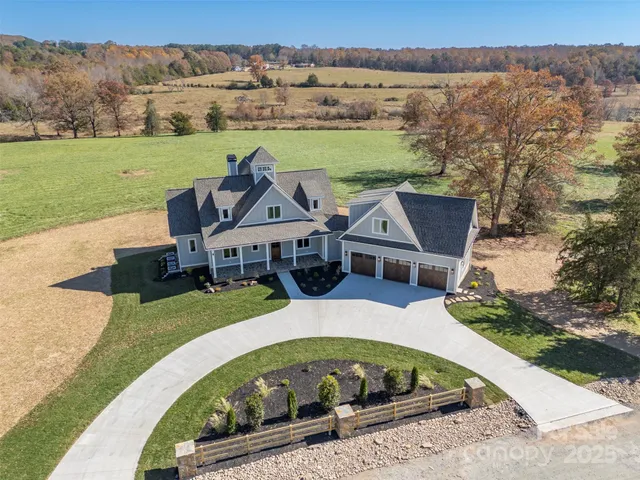 an aerial view of a house with outdoor space