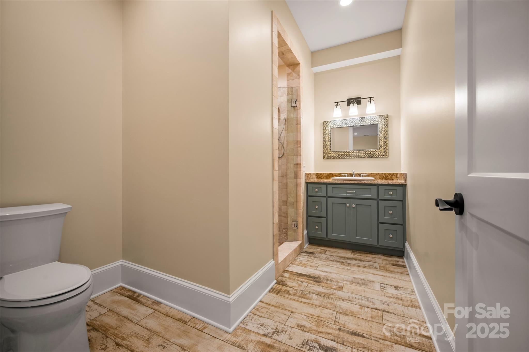 297 Mountain Meadows Lane, Unit 7 Tryon, NC 28782 - Photo 38 of 44 a bathroom with a sink and a mirror