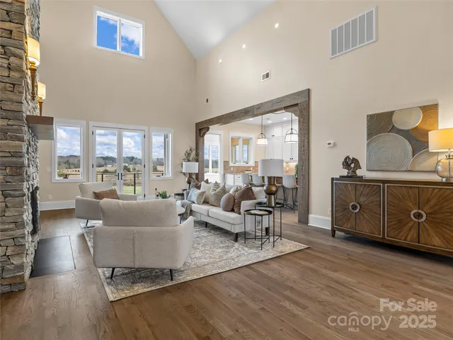 a kitchen with center island table and chairs