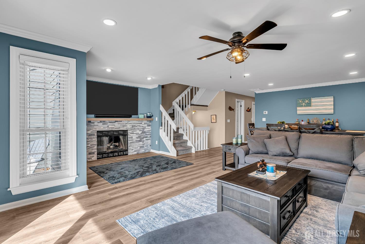 303 Spinnaker Way Neptune, NJ 07753 - Photo 13 of 54 a living room with furniture and a fireplace