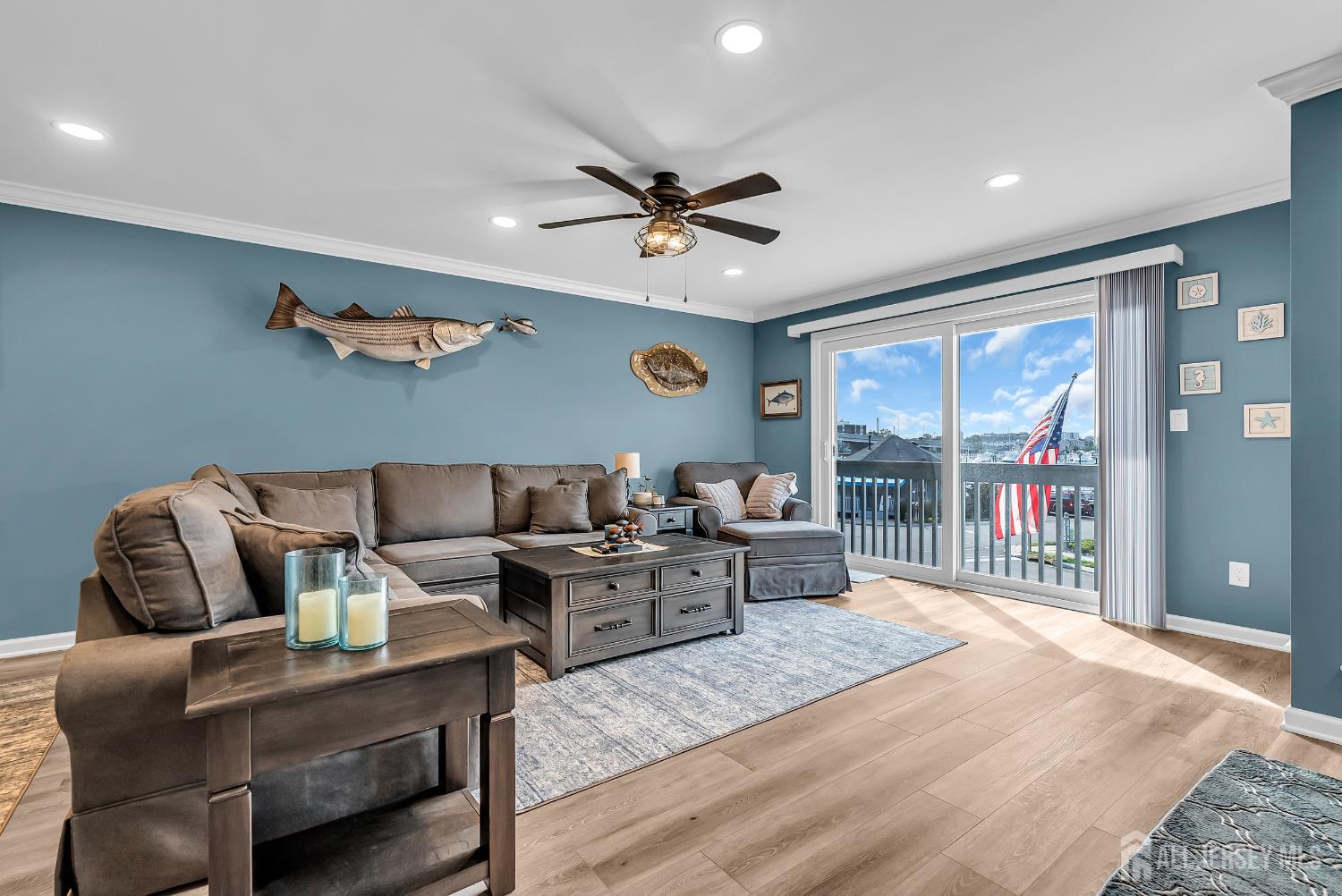 303 Spinnaker Way Neptune, NJ 07753 - Photo 15 of 54 a living room with furniture and a large window