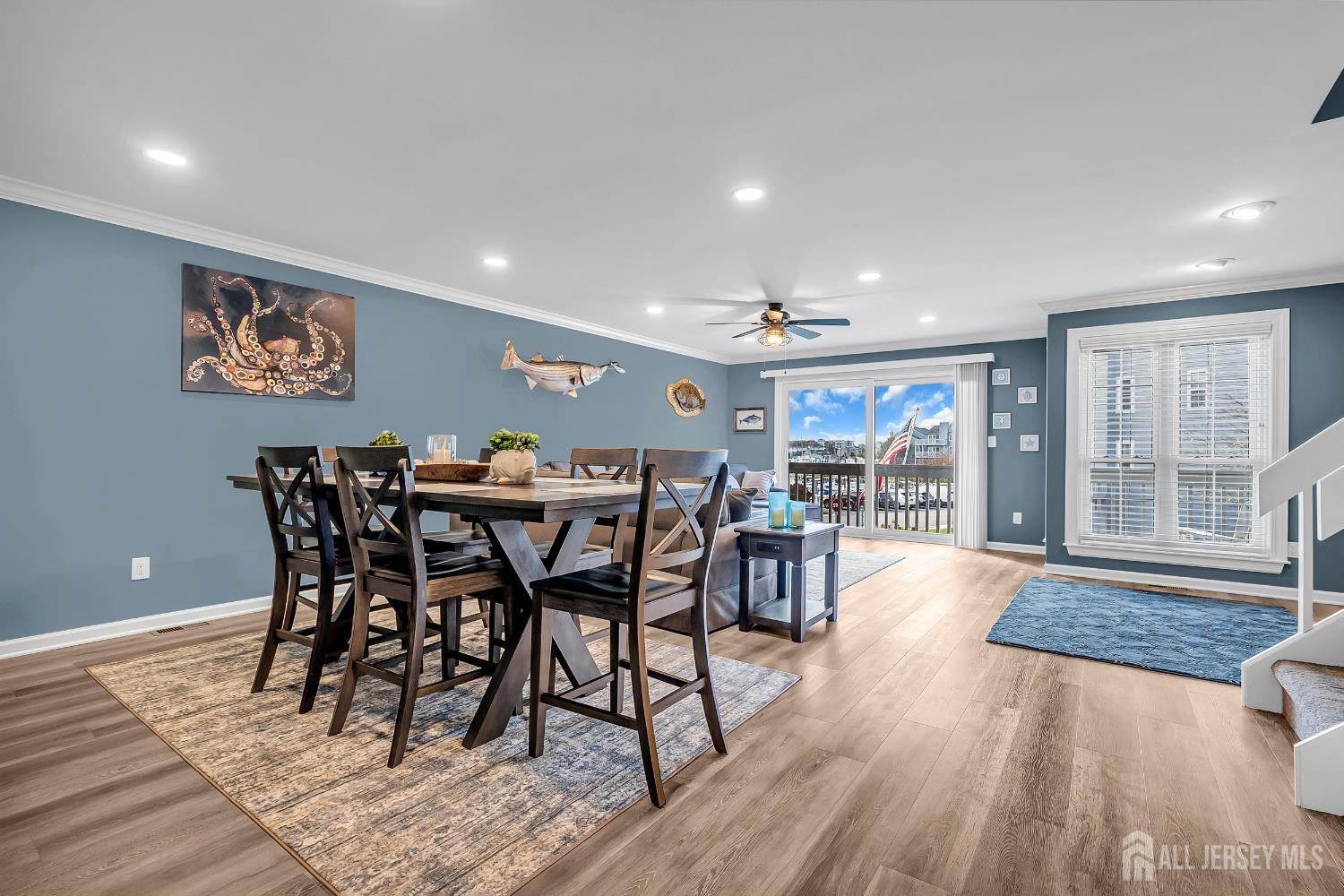 303 Spinnaker Way Neptune, NJ 07753 - Photo 16 of 54 a view of a dining room with furniture window and wooden floor