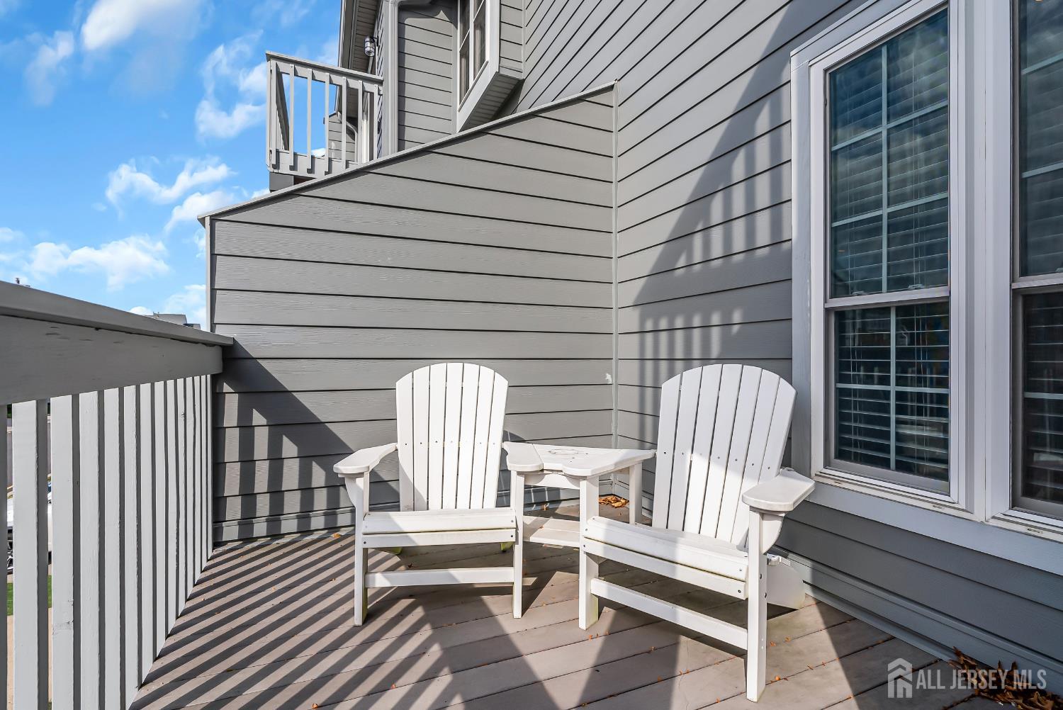 303 Spinnaker Way Neptune, NJ 07753 - Photo 19 of 54 a view of wooden balcony with furniture