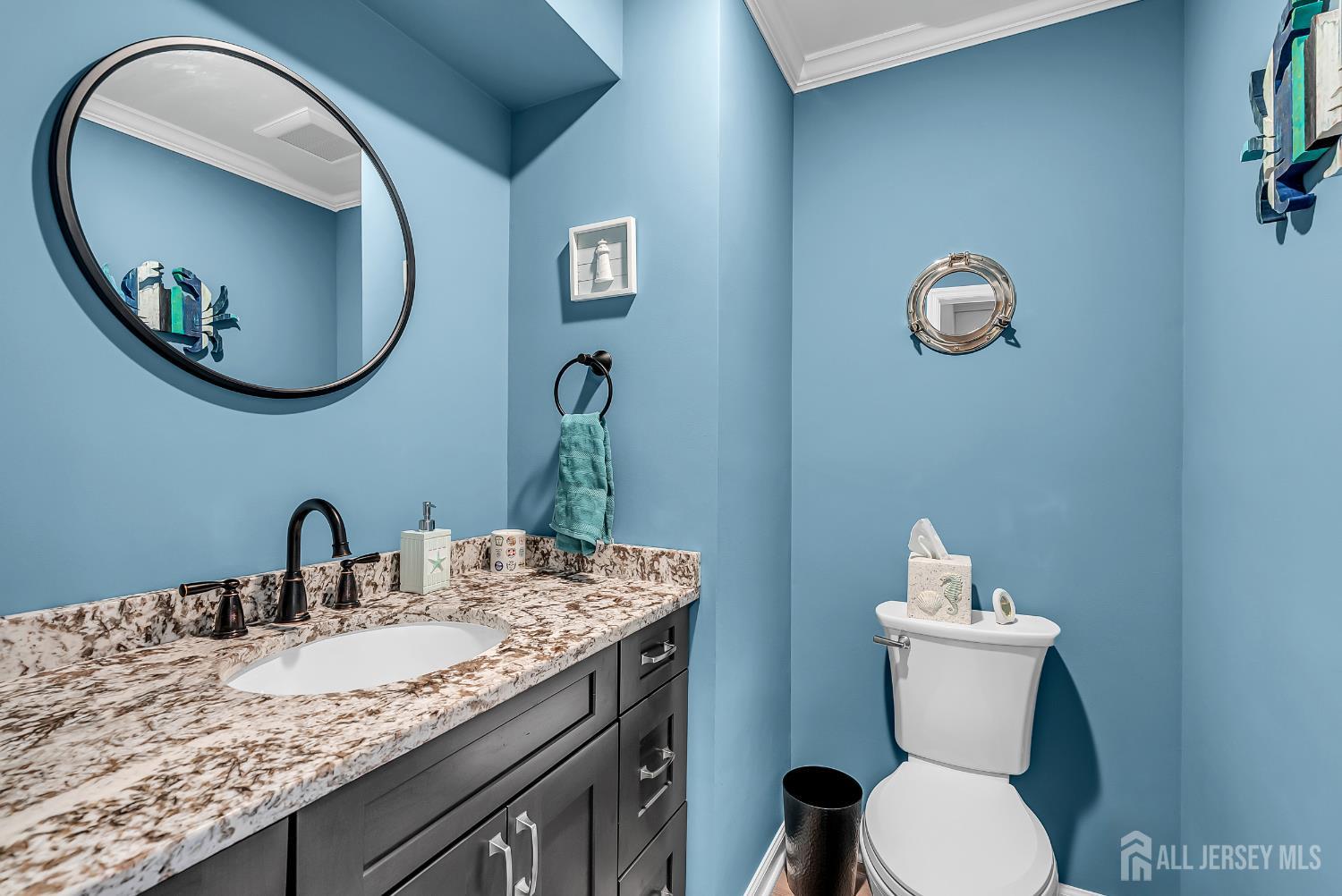 303 Spinnaker Way Neptune, NJ 07753 - Photo 29 of 54 a bathroom with a toilet and a sink