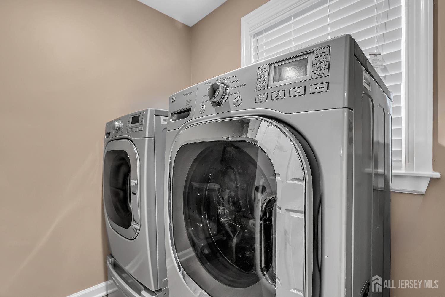 303 Spinnaker Way Neptune, NJ 07753 - Photo 30 of 54 a utility room with dryer and washer
