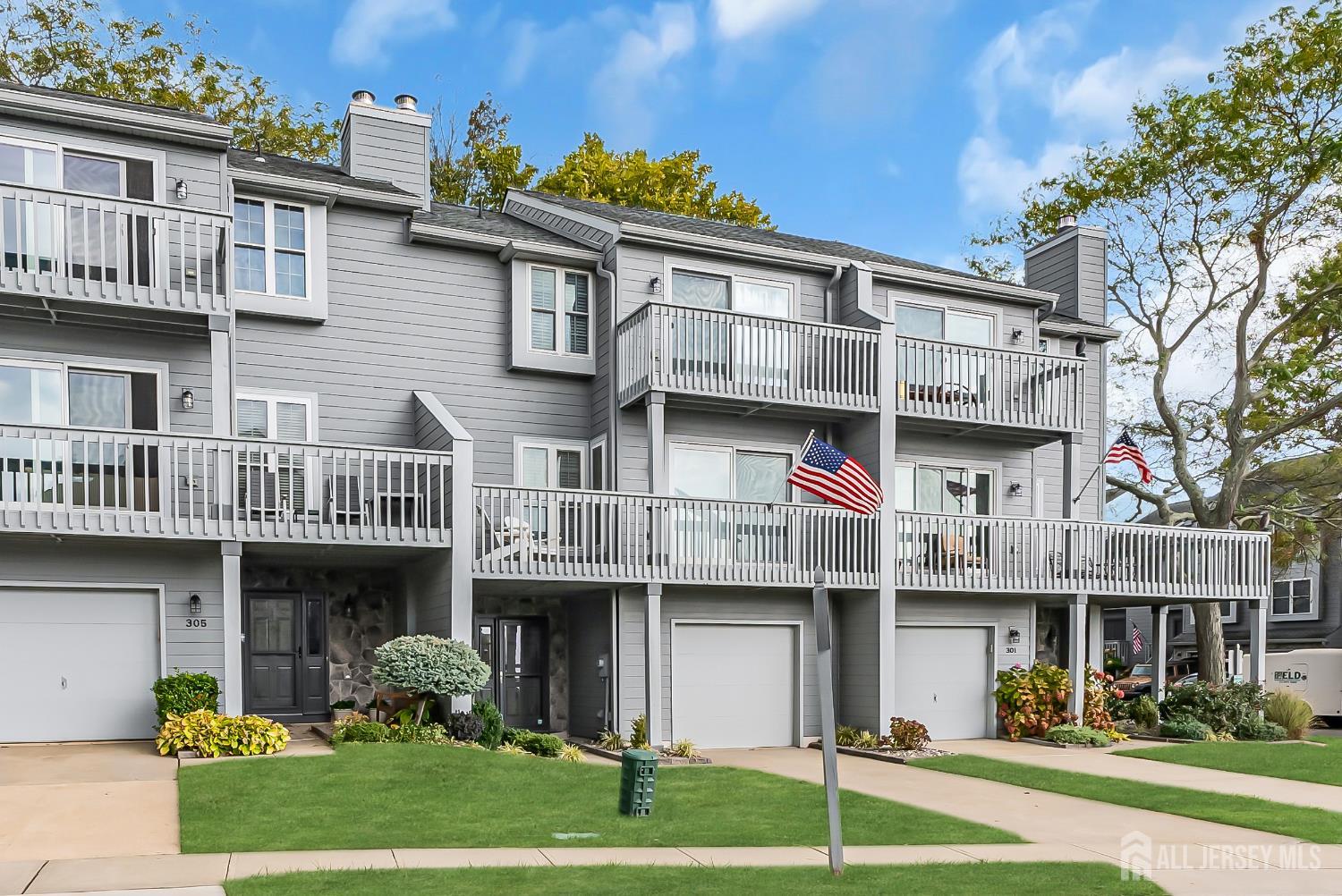 303 Spinnaker Way Neptune, NJ 07753 - Photo 3 of 54 a view of a building with a garden