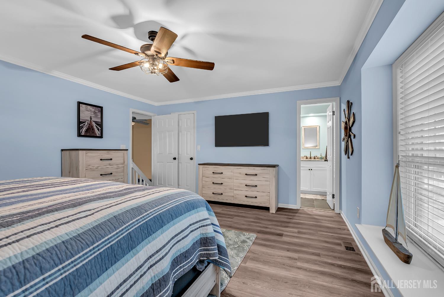 303 Spinnaker Way Neptune, NJ 07753 - Photo 32 of 54 a bedroom with a bed and a flat screen tv