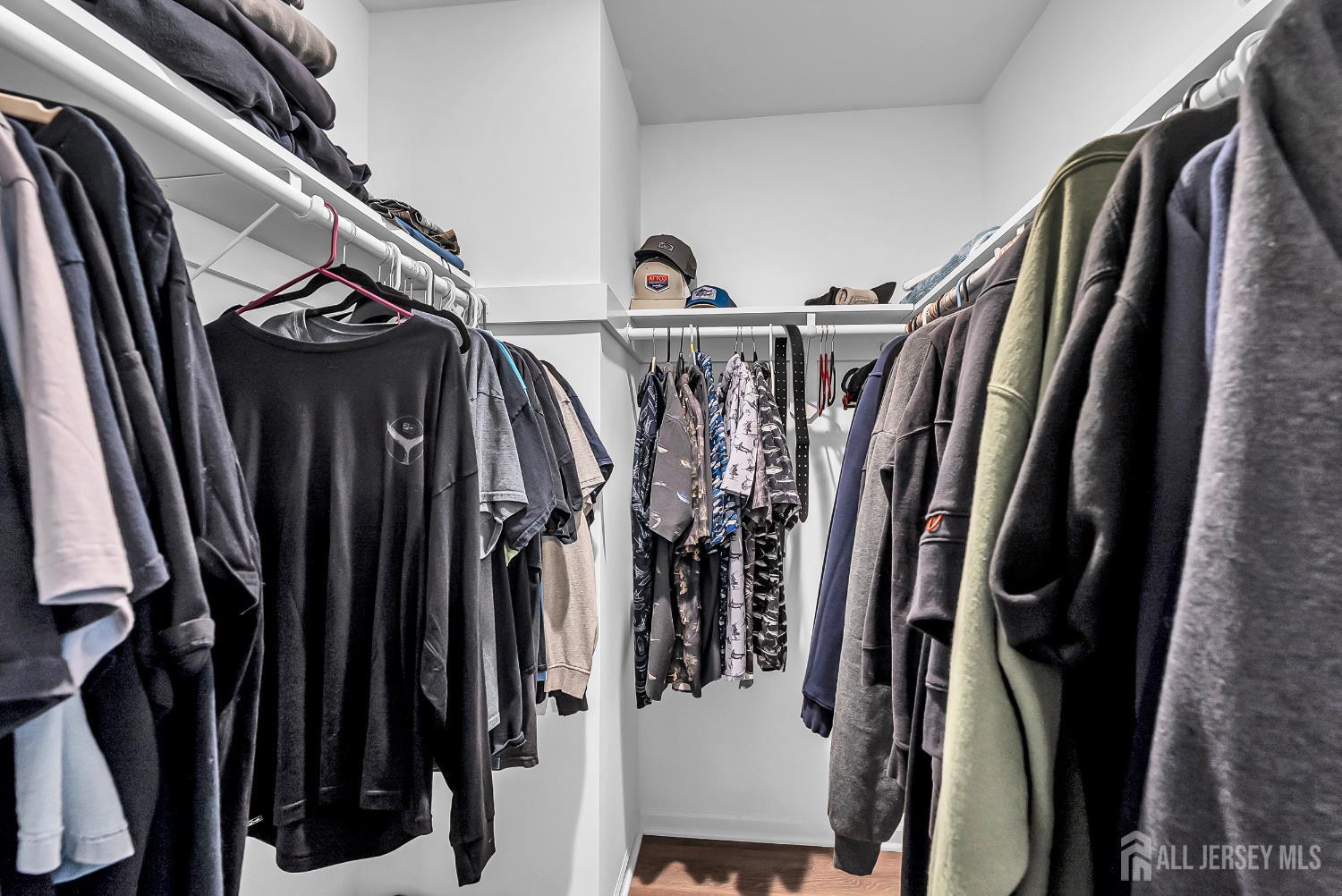 303 Spinnaker Way Neptune, NJ 07753 - Photo 35 of 54 a view of walk in closet with clothes and shoes