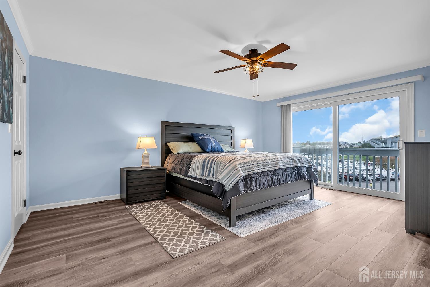 303 Spinnaker Way Neptune, NJ 07753 - Photo 36 of 54 a bedroom with a bed and window