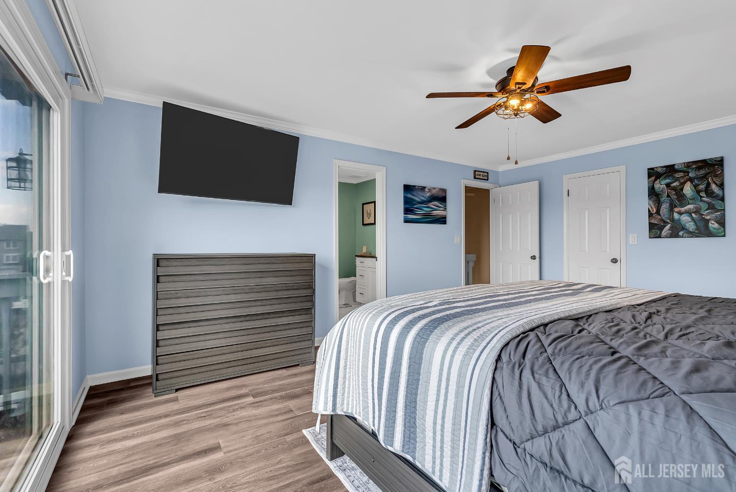 303 Spinnaker Way Neptune, NJ 07753 - Photo 38 of 54 a bedroom with a bed and a flat screen tv