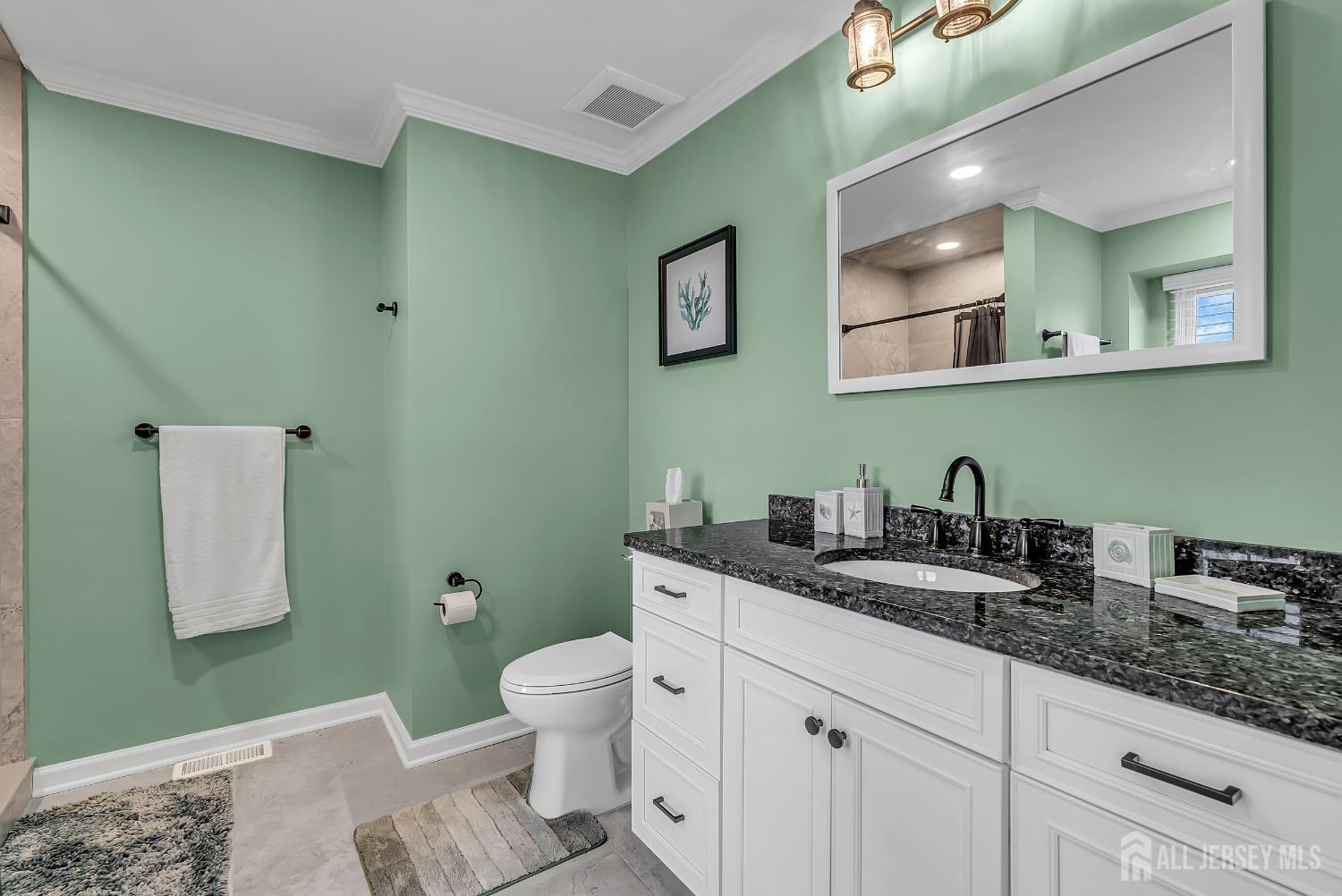 303 Spinnaker Way Neptune, NJ 07753 - Photo 39 of 54 a bathroom with a granite countertop toilet sink and mirror