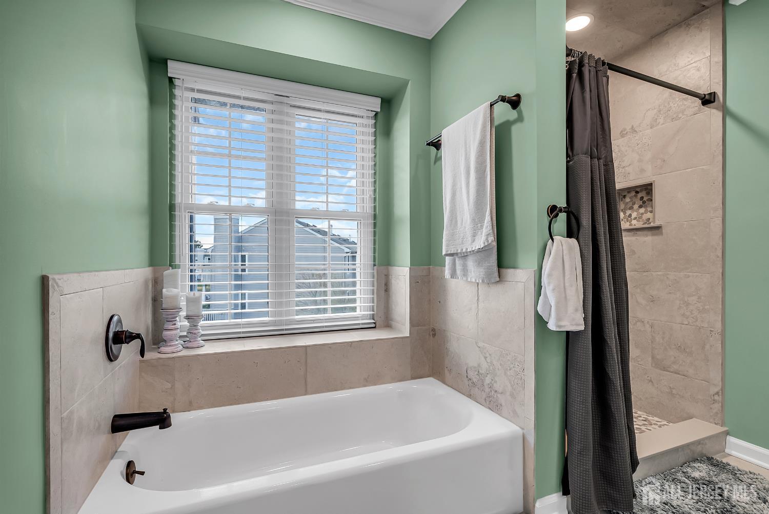 303 Spinnaker Way Neptune, NJ 07753 - Photo 40 of 54 a bathroom with a bathtub and a shower