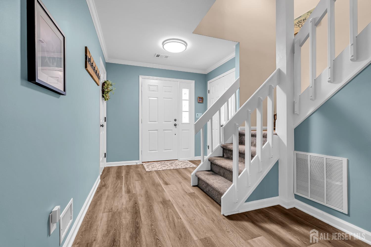 303 Spinnaker Way Neptune, NJ 07753 - Photo 5 of 54 a view of entryway and hall with wooden floor