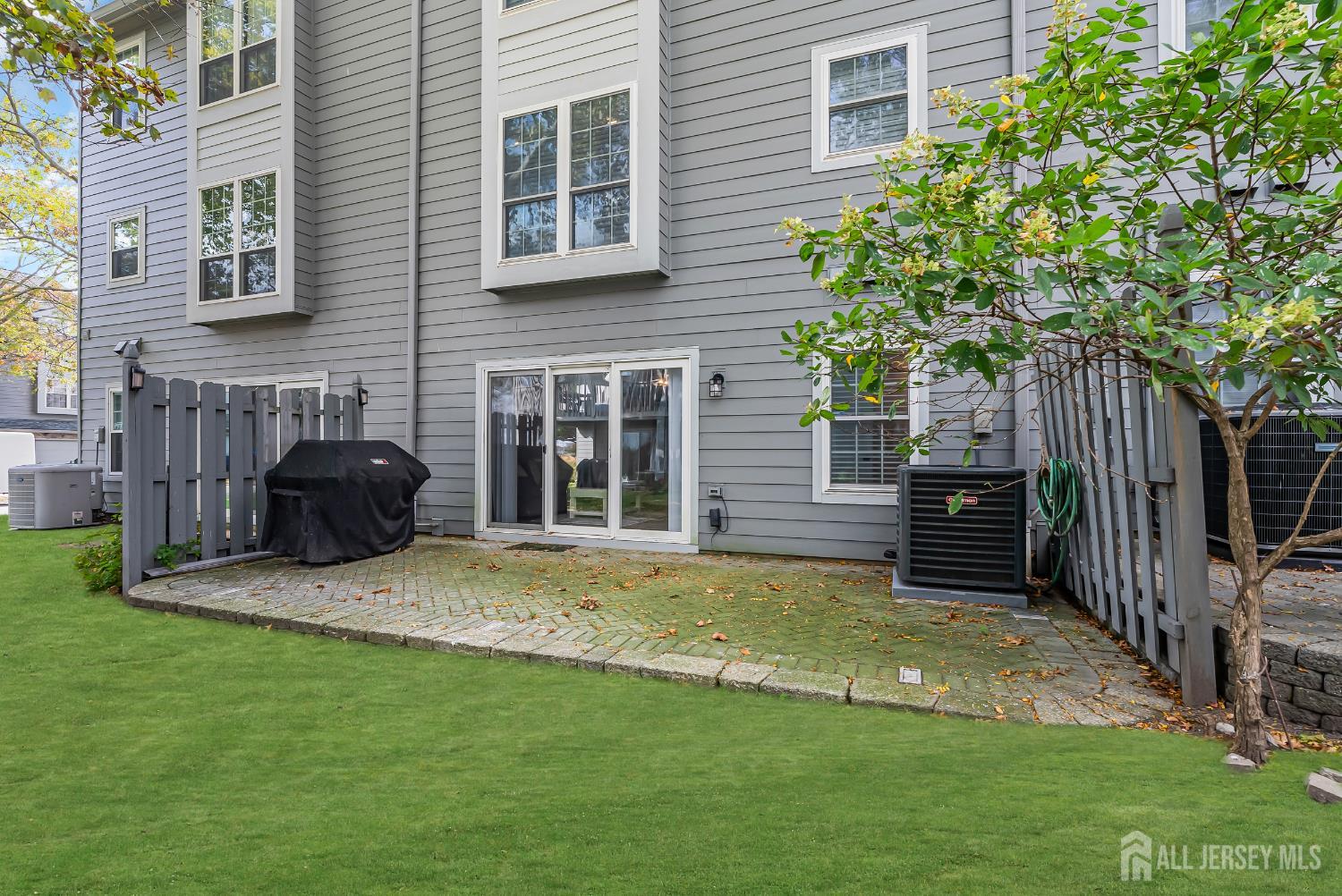 303 Spinnaker Way Neptune, NJ 07753 - Photo 51 of 54 a view of a house with backyard and furniture