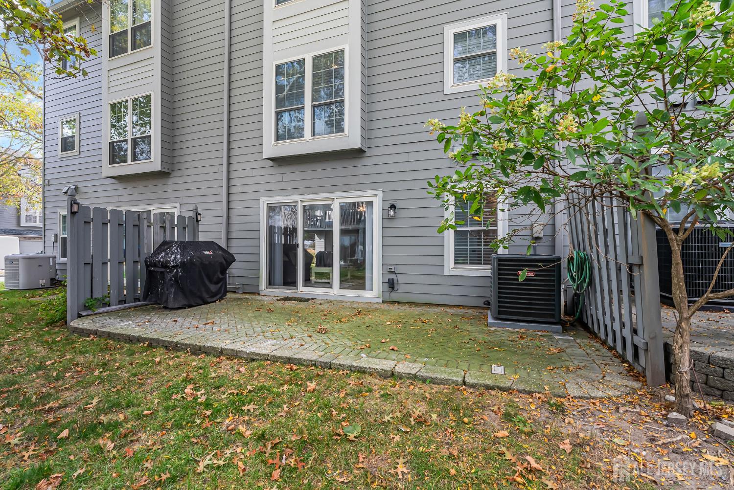 303 Spinnaker Way Neptune, NJ 07753 - Photo 52 of 54 a view of a house with backyard and sitting area