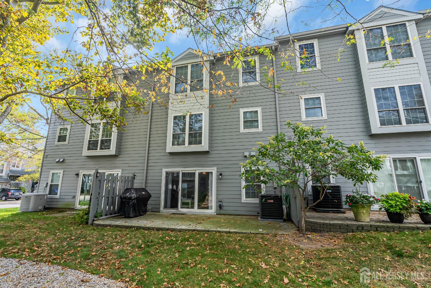 303 Spinnaker Way Neptune, NJ 07753 - Photo 54 of 54 a front view of a house with garden