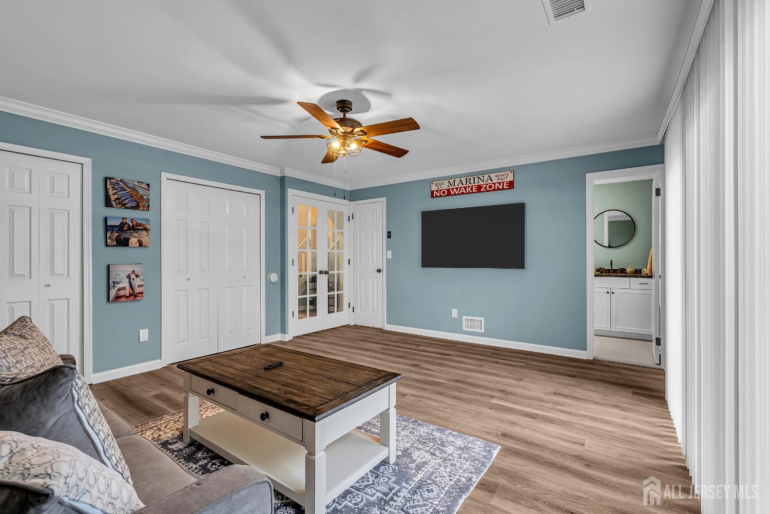 303 Spinnaker Way Neptune, NJ 07753 - Photo 8 of 54 a living room with furniture and a flat screen tv