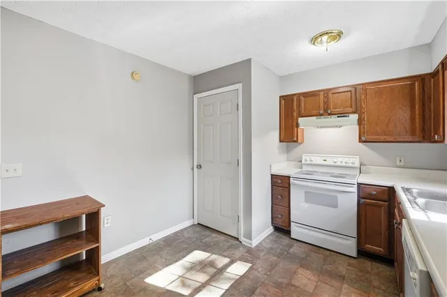 a kitchen with a stove and a cabinet