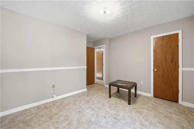 a view of room with hardwood floor and lounge chair